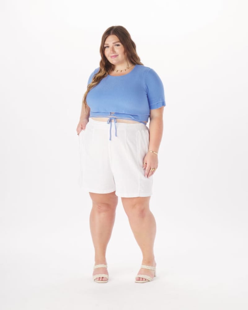 Front of a model wearing a size 5X Dominique Tie-Around Crop Top in Black in Dusty Blue by What Lo Wants. | dia_product_style_image_id:274000